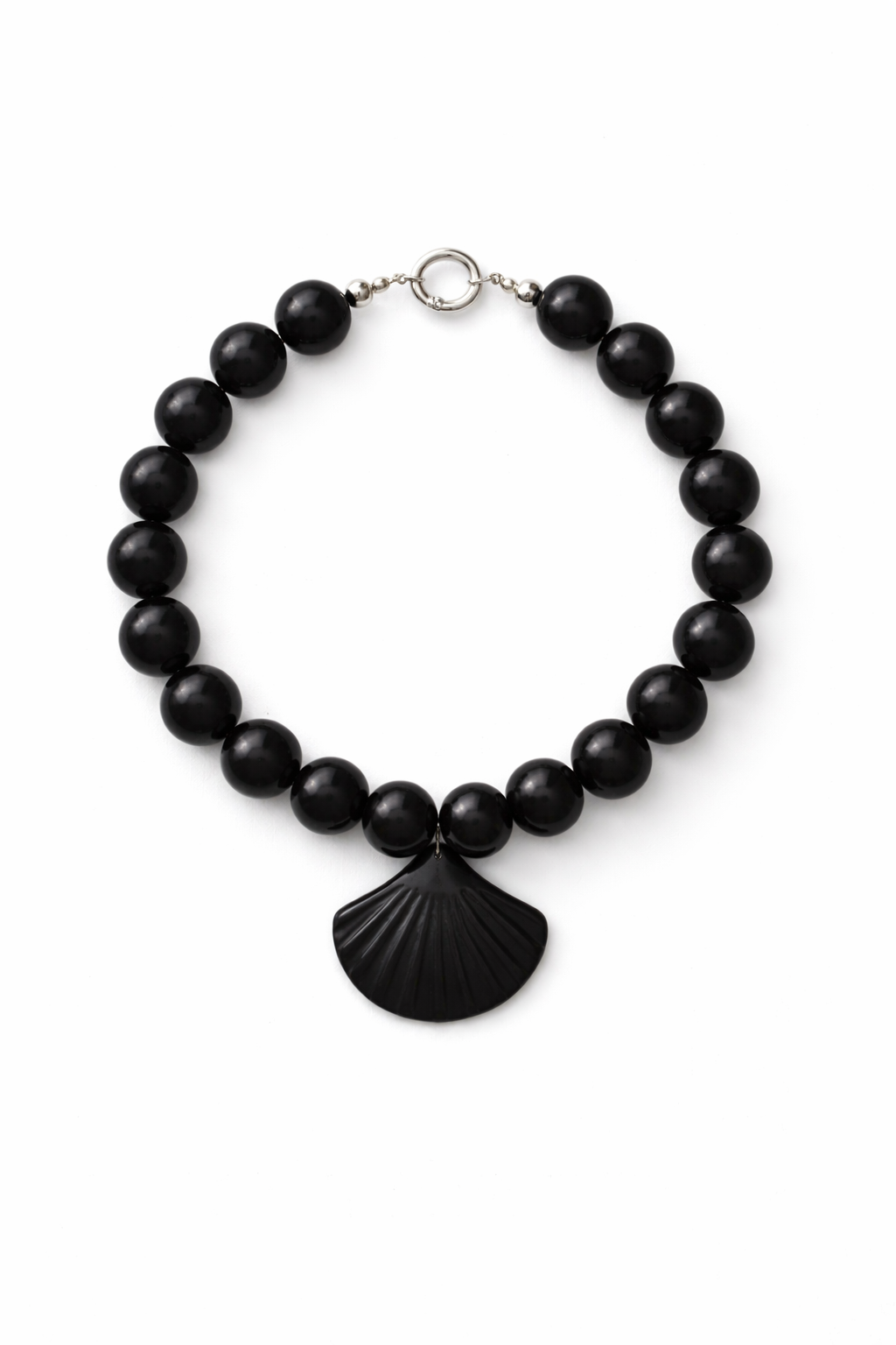Black beaded necklace with a shell pendant on a white background