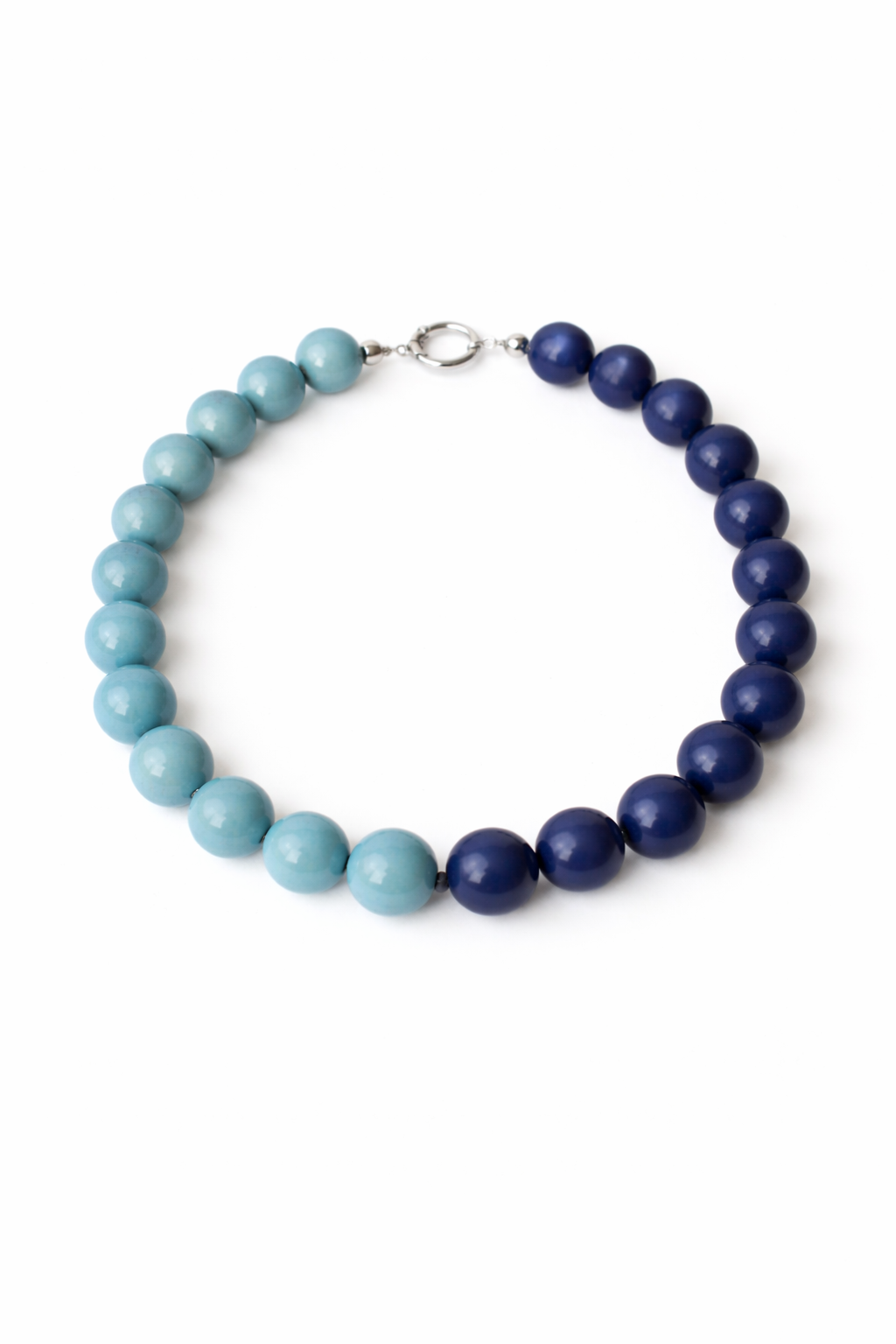 Necklace with blue and light blue beads on a white background